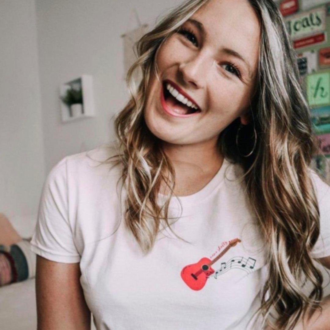 singer songwriter wearing a custom printed guitar t-shirt